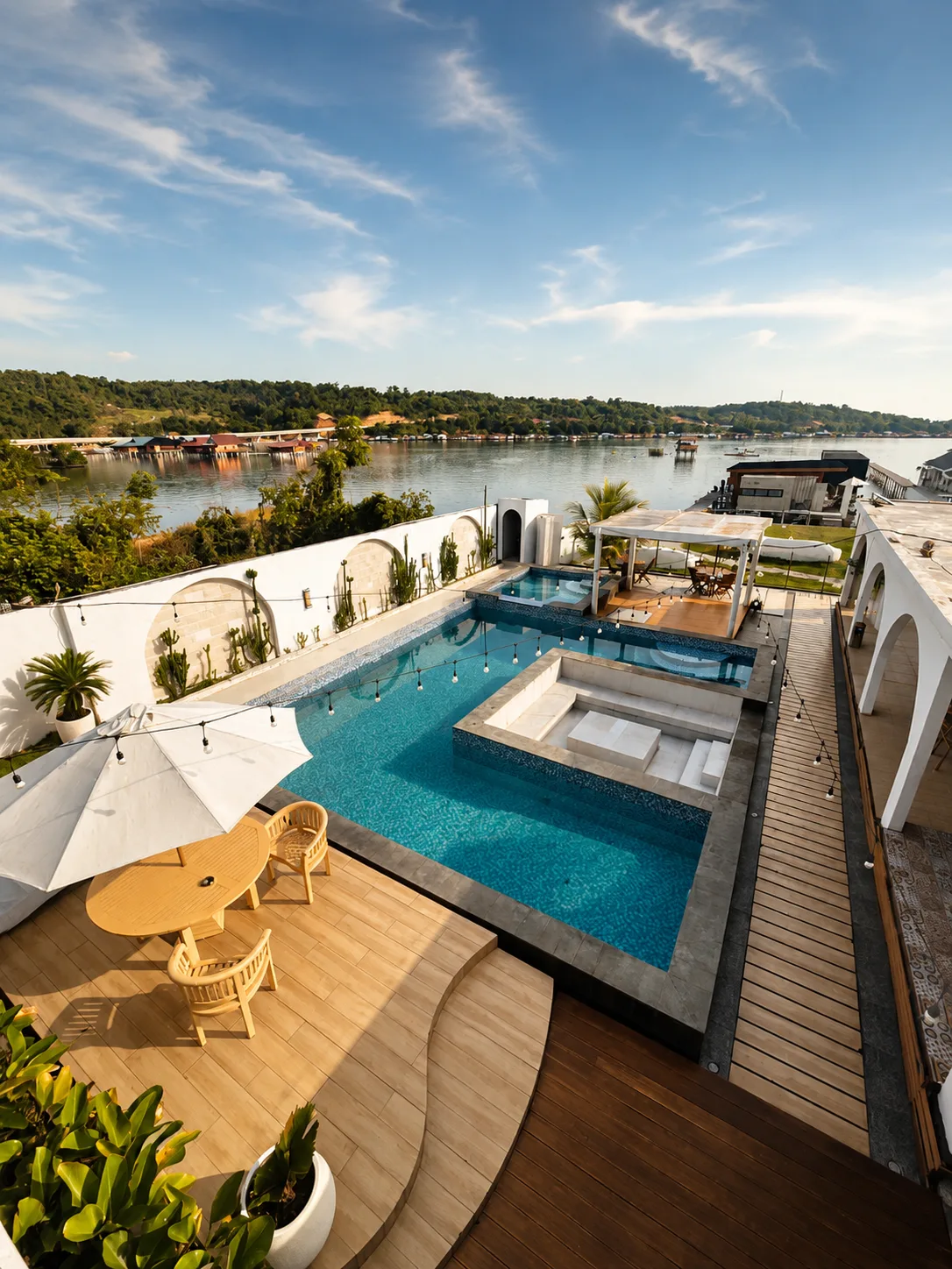 Covered lounge, pool and waterfront deck